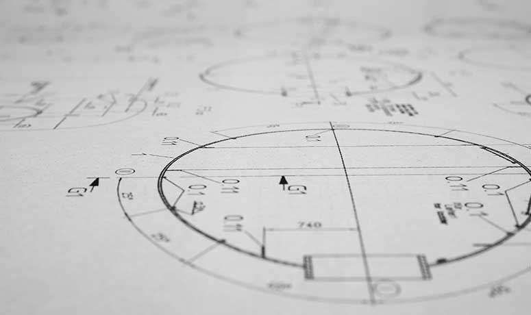 A drawing of a round object on a piece of paper showing the shape and details of the object.